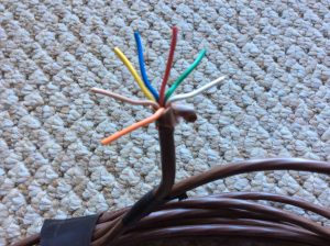 Picture of a typical Seven Conductor Thermostat Cable, showing the different colors of each wire within the cable.